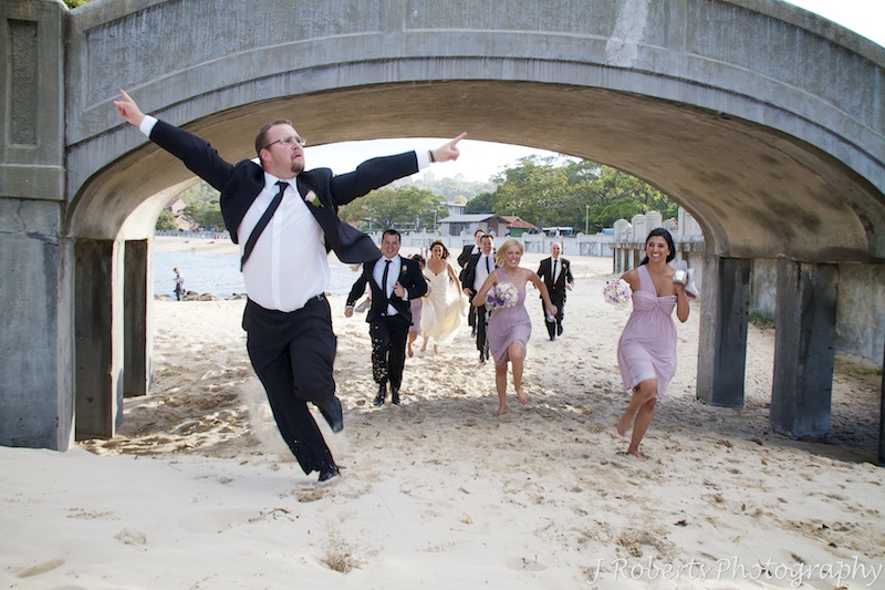 Groomsman celebrating race win - wedding photography sydney